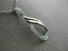 ESTATE .03CT DIAMOND 14KT WHITE GOLD 3D LOVE KNOT SEMI INFINITY FLOATING PENDANT