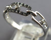 ESTATE .09CT WHITE & BLACK DIAMOND 14KT WHITE GOLD 3D OVAL LOVE KNOT FUN RING