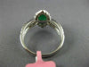 ESTATE 1.53CT DIAMOND & AAA EMERALD 18KT WHITE GOLD CLASSIC HALO ENGAGEMENT RING
