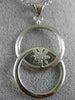 ESTATE LARGE .19CT DIAMOND 18K WHITE GOLD DOUBLE CIRCLE LOVE KNOT FLOWER PENDANT
