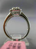 ESTATE LARGE .66CT ROUND & BAGUETTE DIAMOND 18KT WHITE GOLD HALO ENGAGEMENT RING