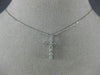 ESTATE .25CT DIAMOND 14KT WHITE GOLD 3D ROUND CLASSIC FLOATING CROSS PENDANT