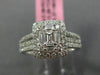 ESTATE LARGE .66CT ROUND & BAGUETTE DIAMOND 18KT WHITE GOLD HALO ENGAGEMENT RING
