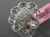 ESTATE LARGE .78CT ROUND & BAGUETTE DIAMOND 18KT WHITE GOLD FLOWER COCKTAIL RING