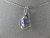 ESTATE .63CT DIAMOND & AAA TANZANITE 14KT WHITE GOLD OVAL INFINITY LOVE PENDANT