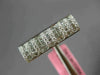 ESTATE .60CT DIAMOND 18KT WHITE GOLD ROUND & PRINCESS INVISIBLE ANNIVERSARY RING