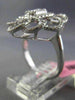 ESTATE LARGE .78CT ROUND & BAGUETTE DIAMOND 18KT WHITE GOLD FLOWER COCKTAIL RING