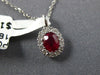 SMALL .62CT DIAMOND & AAA RUBY 18KT WHITE GOLD 3D ROUND & OVAL FLOWER PENDANT