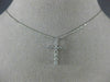 ESTATE .25CT DIAMOND 14KT WHITE GOLD 3D ROUND CLASSIC FLOATING CROSS PENDANT