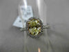 ESTATE 1.32CT GIA FANCY YELLOW DIAMOND 18KT WHITE GOLD OVAL HALO ENGAGEMENT RING
