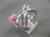 ESTATE 1.12CT ROUND & BAGUETTE DIAMOND 18KT WHITE GOLD CRISS CROSS INFINITY RING