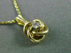 ESTATE SMALL .03CT DIAMOND 14KT YELLOW GOLD 3D FLOATING LOVE KNOT PENDANT #25417