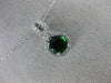 ESTATE 1.20CT DIAMOND & AAA GREEN GARNET 14KT WHITE GOLD ROUND INFINITY PENDANT