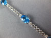 8.14CT DIAMOND & AAA BLUE TOPAZ 14KT WHITE GOLD 3D OVAL & ROUND TENNIS BRACELET