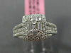 ESTATE LARGE .66CT ROUND & BAGUETTE DIAMOND 18KT WHITE GOLD HALO ENGAGEMENT RING