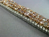 WIDE 22.84CT WHITE & PINK DIAMOND 18KT WHITE & ROSE GOLD CLUSTER TENNIS BRACELET