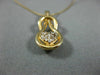 ESTATE .25CT DIAMOND 14KT YELLOW GOLD HEART LOVE KNOT INFINITY FLOATING PENDANT