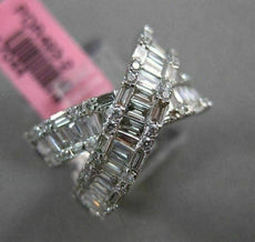 ESTATE 1.12CT ROUND & BAGUETTE DIAMOND 18KT WHITE GOLD CRISS CROSS INFINITY RING