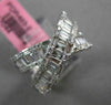ESTATE 1.12CT ROUND & BAGUETTE DIAMOND 18KT WHITE GOLD CRISS CROSS INFINITY RING
