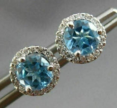 ESTATE 1.17CT DIAMOND & AAA BLUE TOPAZ 14KT WHITE GOLD ROUND HALO STUD EARRINGS