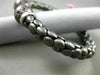 ESTATE 1.20CT RUBY 14KT WHITE & BLACK GOLD 3D FLEXIBLE HAMMERED BANGLE BRACELET