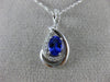 ESTATE .63CT DIAMOND & AAA TANZANITE 14KT WHITE GOLD OVAL INFINITY LOVE PENDANT