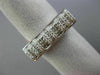 ESTATE .60CT ROUND & PRINCESS DIAMOND 18KT WHITE GOLD RECTANGULAR INVISIBLE RING