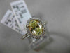 ESTATE 1.32CT GIA FANCY YELLOW DIAMOND 18KT WHITE GOLD OVAL HALO ENGAGEMENT RING