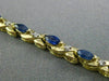 ESTATE 1.21CT DIAMOND & AAA MARQUISE SAPPHIRE 14KT TWO TONE GOLD X LOVE BRACELET