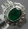 WIDE 2.19CT DIAMOND & EMERALD 18KT WHITE GOLD OVAL ROUND & BAGUETTE FLOWER RING