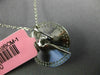 ESTATE .83CT DIAMONDS 18KT WHITE GOLD CIRCULAR MULTI ROW SWIRL SOLITAIRE PENDANT