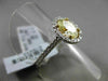 ESTATE 1.32CT GIA FANCY YELLOW DIAMOND 18KT WHITE GOLD OVAL HALO ENGAGEMENT RING