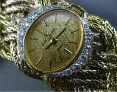 ESTATE LARGE & LONG BAUME & MERCIER .88CT DIAMOND 18K TWO TONE GOLD WOVEN WATCH