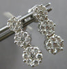 1.0CT DIAMOND 14KT WHITE GOLD 3D MULTI FLOWER JOURNEY SCREWBACK HANGING EARRINGS