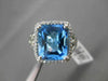ESTATE 6.43CTW DIAMOND & AAA EXTRA FACET BLUE TOPAZ 14KT WHITE GOLD HALO RING