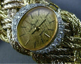 ESTATE LARGE & LONG BAUME & MERCIER .88CT DIAMOND 18K TWO TONE GOLD WOVEN WATCH