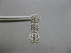 1.0CT DIAMOND 14KT WHITE GOLD 3D MULTI FLOWER JOURNEY SCREWBACK HANGING EARRINGS