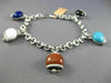 ESTATE LONG .81CT DIAMOND & MULTI GEM 14KT WHITE GOLD LUCKY BELL CHARM BRACELET