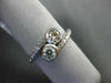ESTATE .68CT DIAMOND 14KT WHITE GOLD 3D TWO STONE CRISS CROSS INFINITY LOVE RING