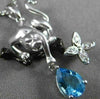 ESTATE .77CT DIAMOND & BLUE TOPAZ 14KT WHITE & BLACK GOLD PANTHER FLOWER PENDANT