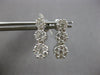 1.0CT DIAMOND 14KT WHITE GOLD 3D MULTI FLOWER JOURNEY SCREWBACK HANGING EARRINGS