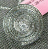 ESTATE .83CT DIAMONDS 18KT WHITE GOLD CIRCULAR MULTI ROW SWIRL SOLITAIRE PENDANT