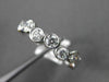 ESTATE .75CT ROUND DIAMOND 14KT WHITE GOLD WAVE BEZEL ETOILE ANNIVERSARY RING