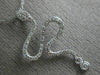 ESTATE .21CT ROUND DIAMOND 14K WHITE GOLD CLASSIC HAPPY SNAKE FLOATING PENDANT