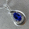 ESTATE .63CT DIAMOND & AAA TANZANITE 14KT WHITE GOLD OVAL INFINITY LOVE PENDANT