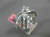 ESTATE 1.12CT ROUND & BAGUETTE DIAMOND 18KT WHITE GOLD CRISS CROSS INFINITY RING