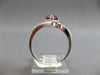 1.18CT DIAMOND & AAA GARNET 14KT WHITE GOLD PEAR SHAPE & ROUND CRISS CROSS RING