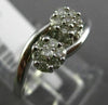 ESTATE .25CT ROUND DIAMOND 14KT WHITE GOLD 3D DOUBLE FLOWE INFINITY LOVE RING