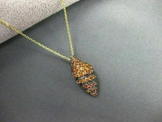 ESTATE 1.36CT YELLOW SAPPHIRE 14KT YELLOW & BLACK GOLD SEA SHELL PENDANT & CHAIN