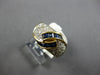 1.20CT DIAMOND & AAA SAPPHIRE 18KT YELLOW GOLD ROUND & BAGUETTE CRISS CROSS RING